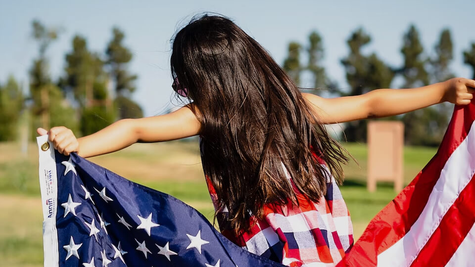 girl holding a flag